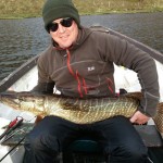 Stu Bamford with a cracking loch pike with a lime green and silver pike fly.